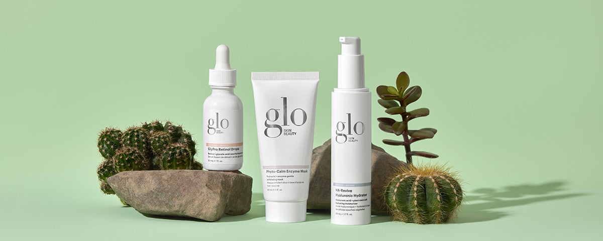 glo SKIN BEAUTY: Phyto-Retinol Drops; Phyto-Calm Enzyme Mask; HA-Revive Hyaluronic Hydrator with cacti on green background