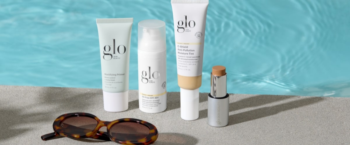 glo, glo skin beauty: Purifying Primer; Oil-Free SPF 40+; C-Shield Anti-Pollution Moisture Tint on poolside deck with sunglasses