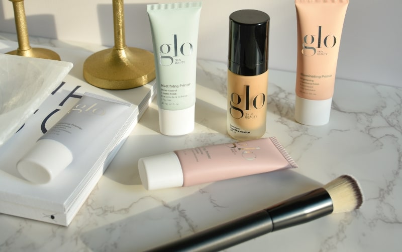 glo skin beauty primers and foundation with brush on marble; Mattifying Primer, Illuminating Primer visible.