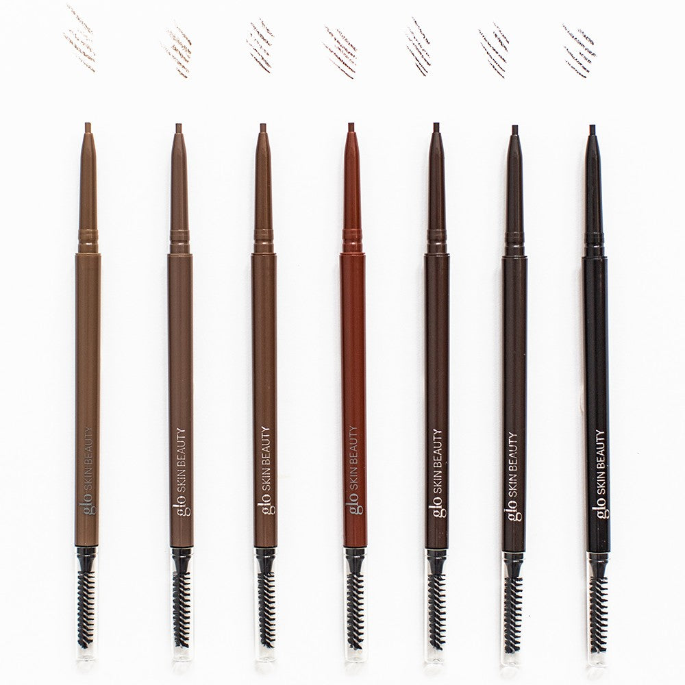 Eight brow pencils in varying shades with spoolie ends and tip swatches above; visible text 'glo SKIN BEAUTY'