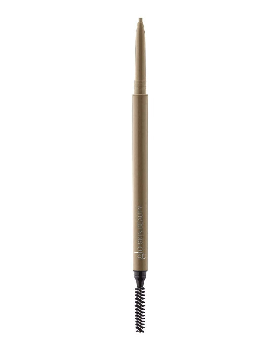 Retractable eyebrow pencil with spoolie, light brown barrel labeled 'glo SKIN BEAUTY'.