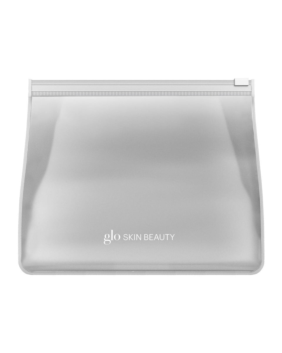 Translucent travel pouch with centered 'glo SKIN BEAUTY' logo.