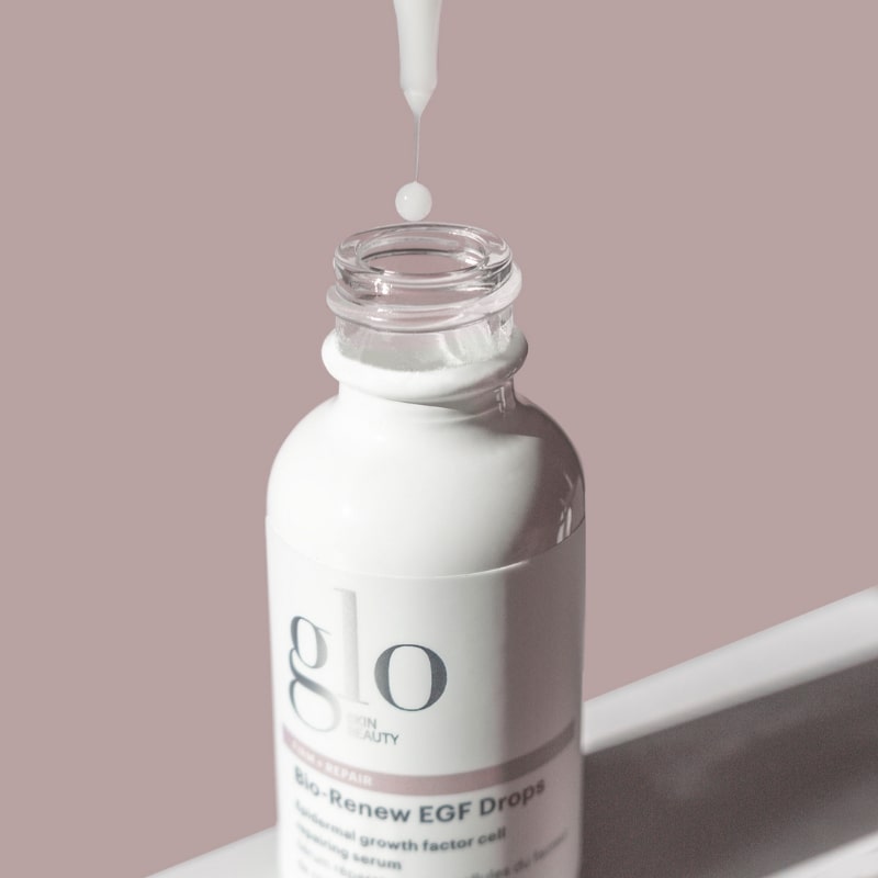 glo skin beauty Bio-Renew EGF Drops bottle with dropper and a serum droplet above the opening
