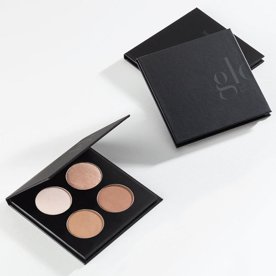 Black compact contour palette with four cream-to-brown pans; glo logo visible on the lid
