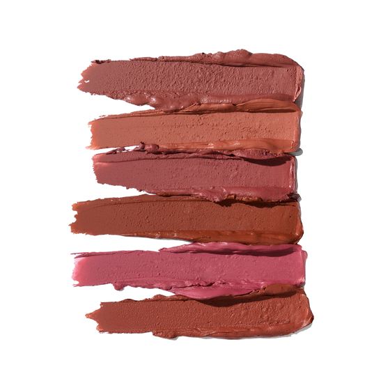 Six horizontal matte lip crayon swatches in suede shades, from light nude to deep rose