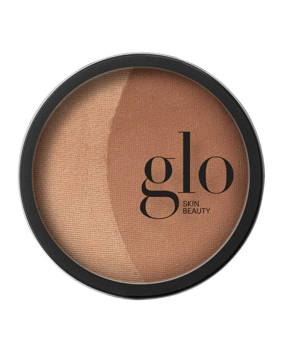 glo SKIN BEAUTY bronzer compact with two warm bronze shades in round pan