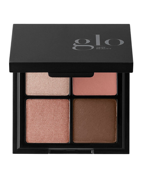 glo SKIN BEAUTY four-pan eyeshadow quad in neutral pink and brown shades, black compact