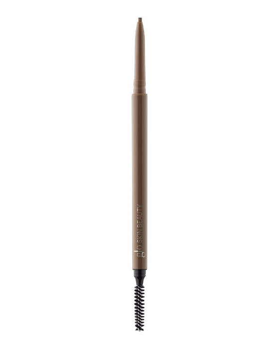 Slim retractable brown brow pencil with spoolie, branded GLO SKIN BEAUTY on barrel.