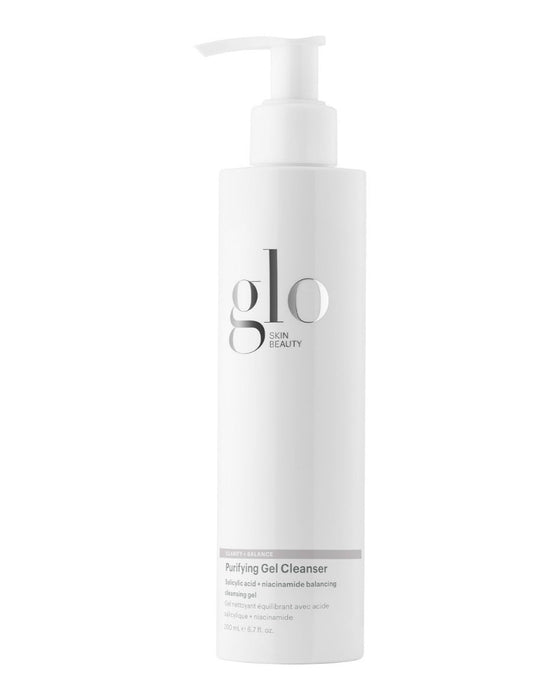 Tall white pump bottle labeled glo SKIN BEAUTY Purifying Gel Cleanser.