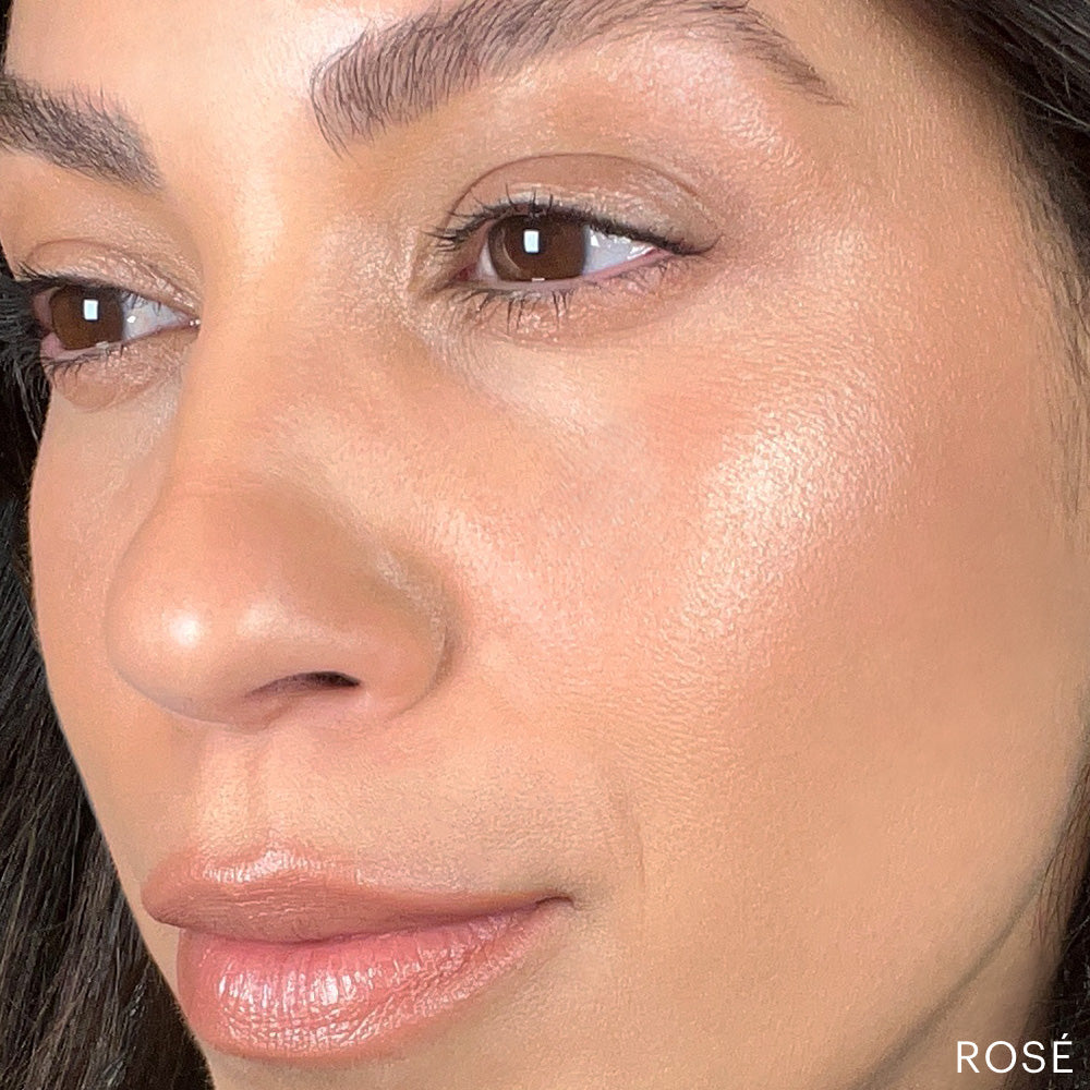 Woman's cheek, nose and lips with dewy rosé makeup finish; 'ROSÉ' visible at bottom-right.